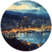 Wellington cityscape at night with illuminated buildings and mountains in the background